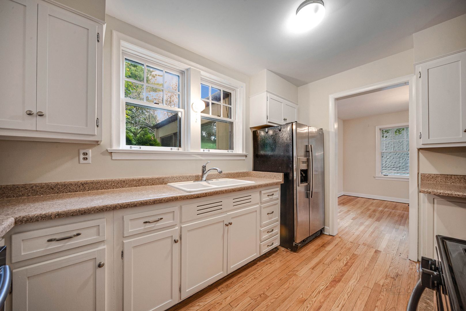 175 Wildwood Road Lake Forest, IL 60045 - Photo 11 of 28 a kitchen with a refrigerator sink and cabinets
