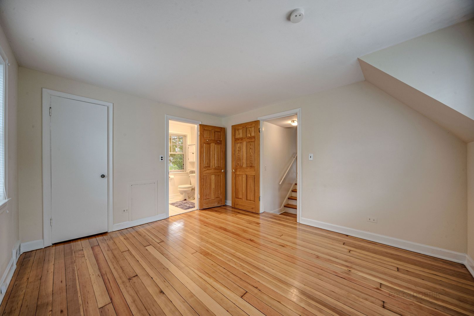 175 Wildwood Road Lake Forest, IL 60045 - Photo 12 of 28 a view of an empty room with wooden floor and closet