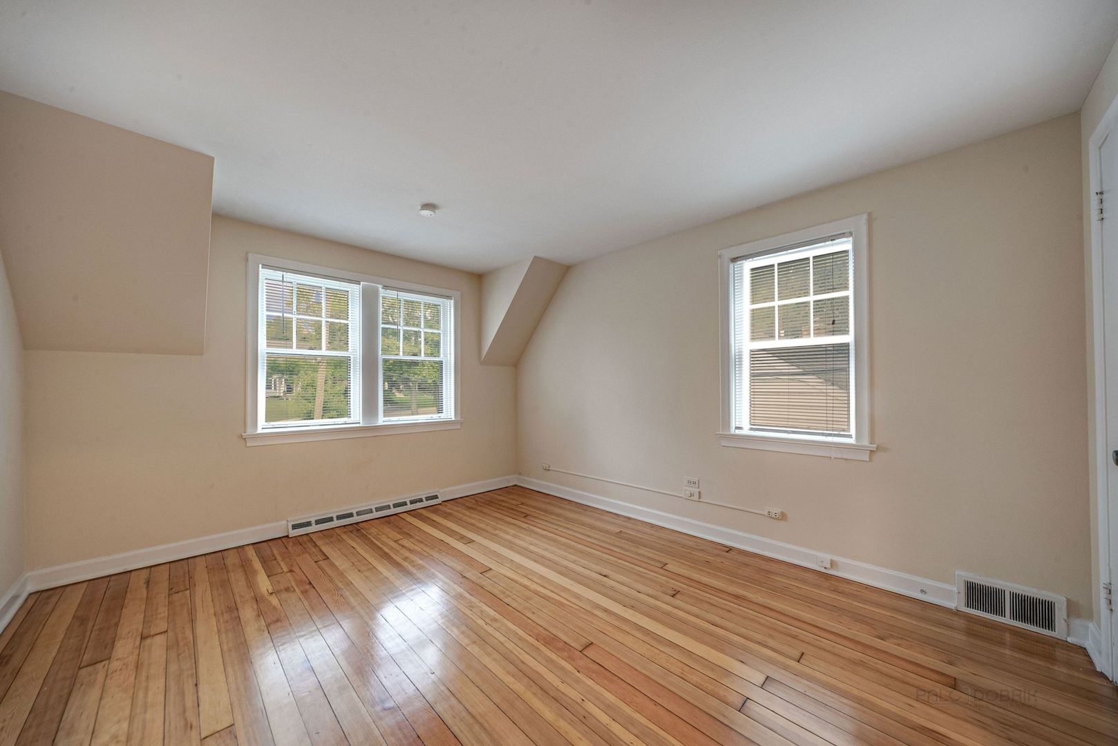 175 Wildwood Road Lake Forest, IL 60045 - Photo 14 of 28 an empty room with wooden floor and windows