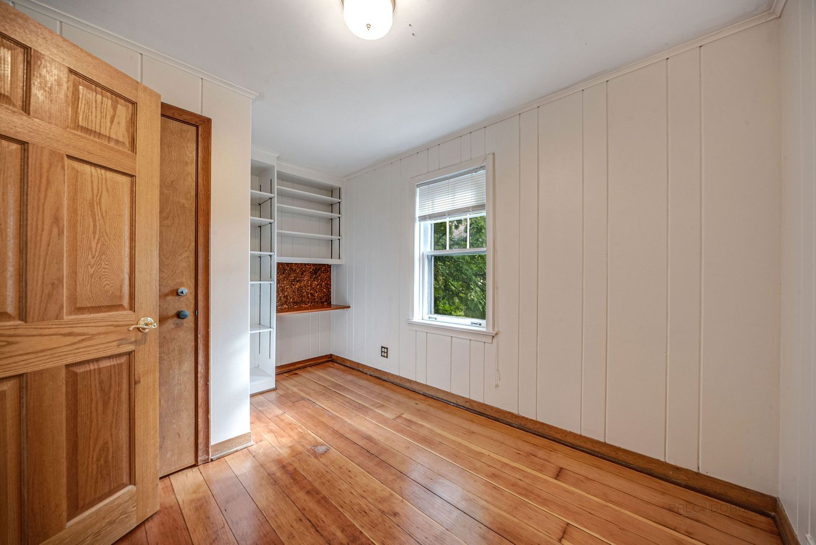 175 Wildwood Road Lake Forest, IL 60045 - Photo 16 of 28 a view of a livingroom with wooden floor and a window