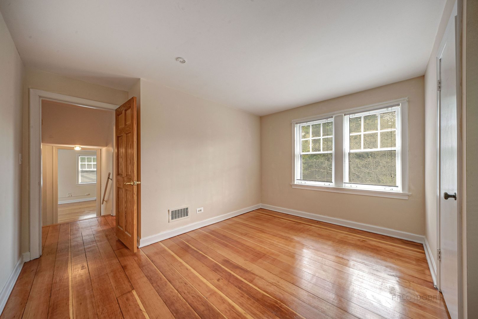 175 Wildwood Road Lake Forest, IL 60045 - Photo 18 of 28 a view of an empty room with wooden floor and a window