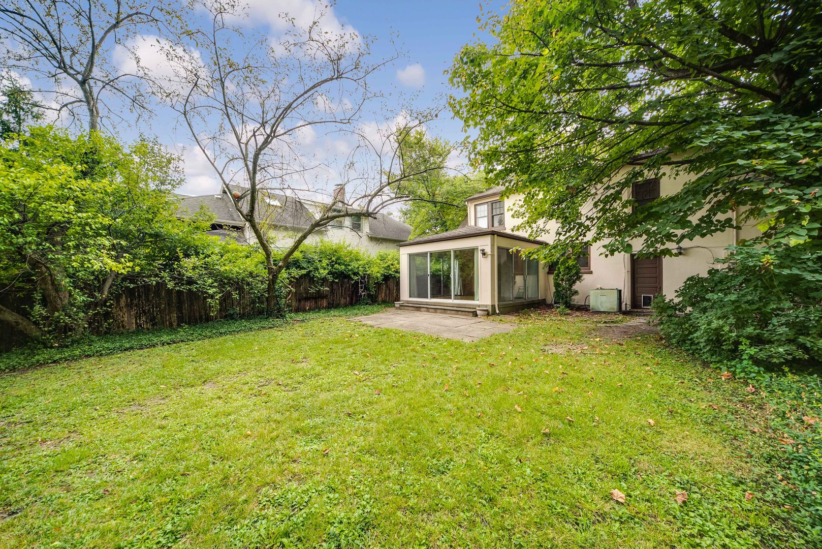 175 Wildwood Road Lake Forest, IL 60045 - Photo 24 of 28 a front view of a house with a garden