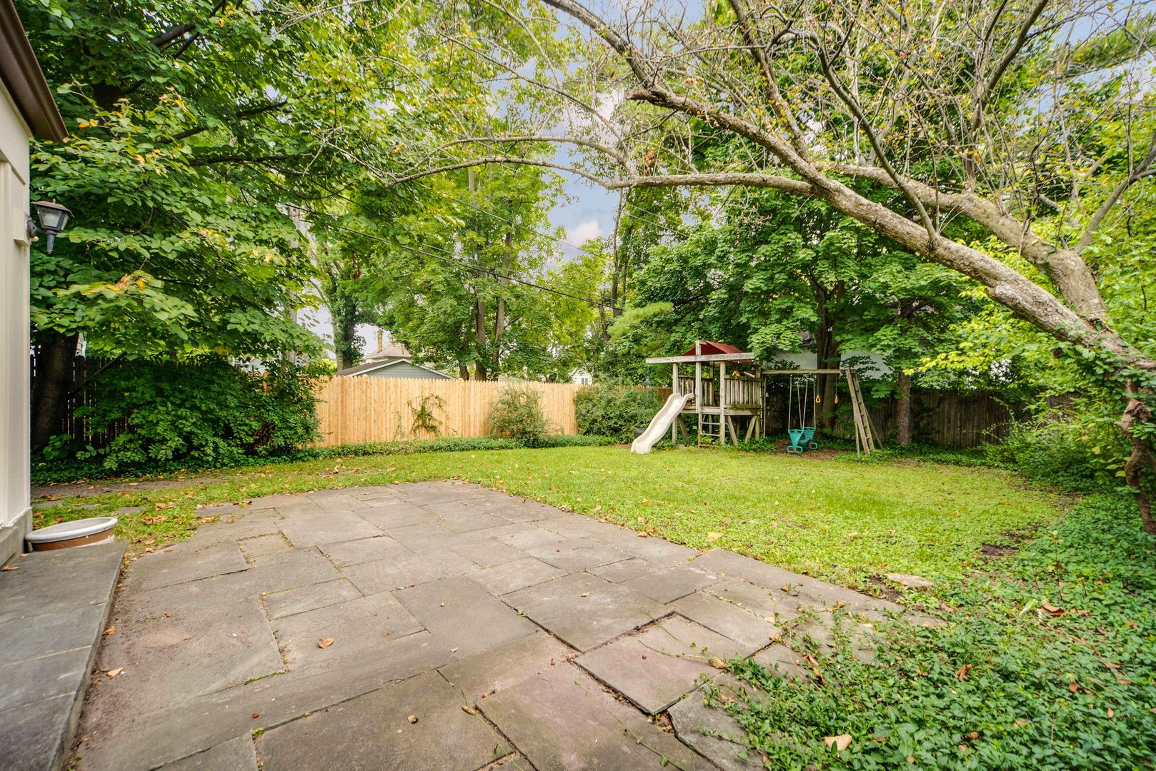 175 Wildwood Road Lake Forest, IL 60045 - Photo 27 of 28 a view of a yard with plants and a bench