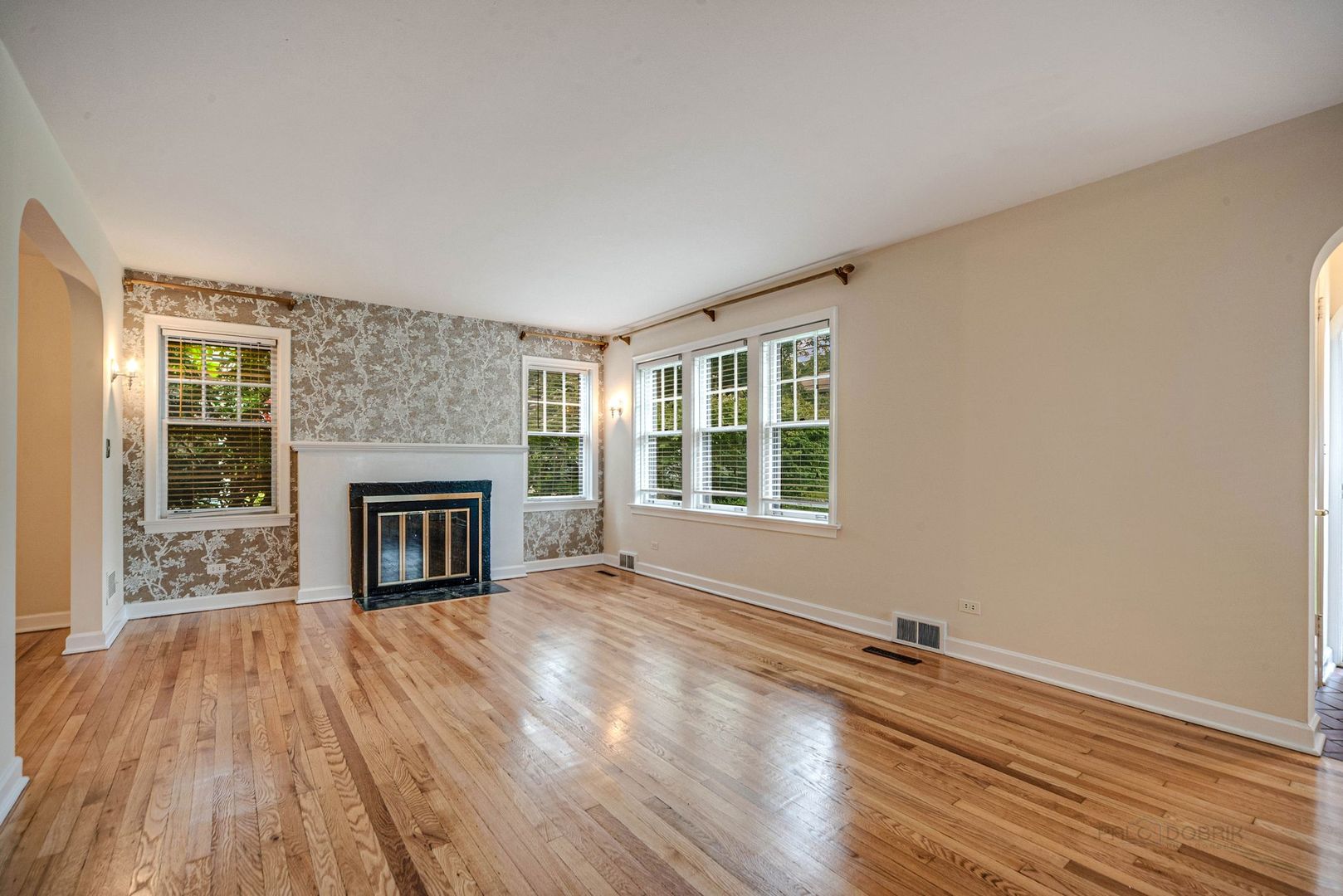 175 Wildwood Road Lake Forest, IL 60045 - Photo 4 of 28 a view of empty room with wooden floor and fireplace