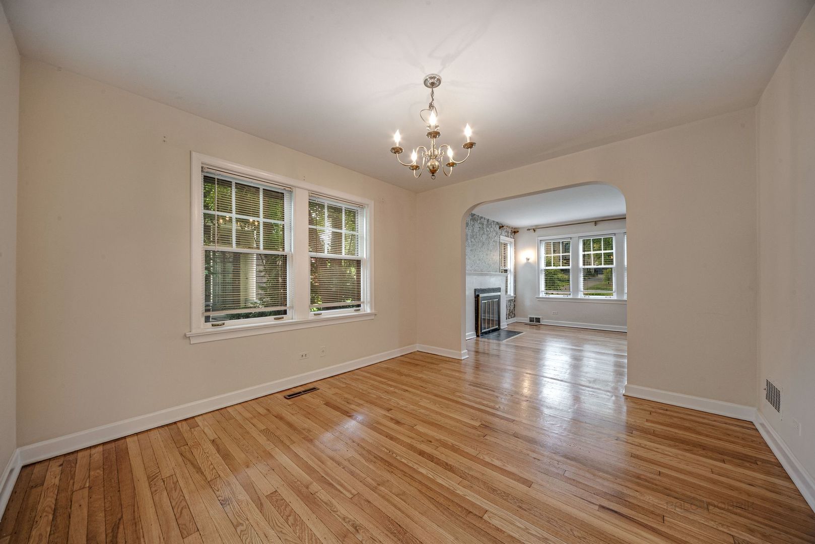 175 Wildwood Road Lake Forest, IL 60045 - Photo 7 of 28 a view of an empty room with wooden floor and a window