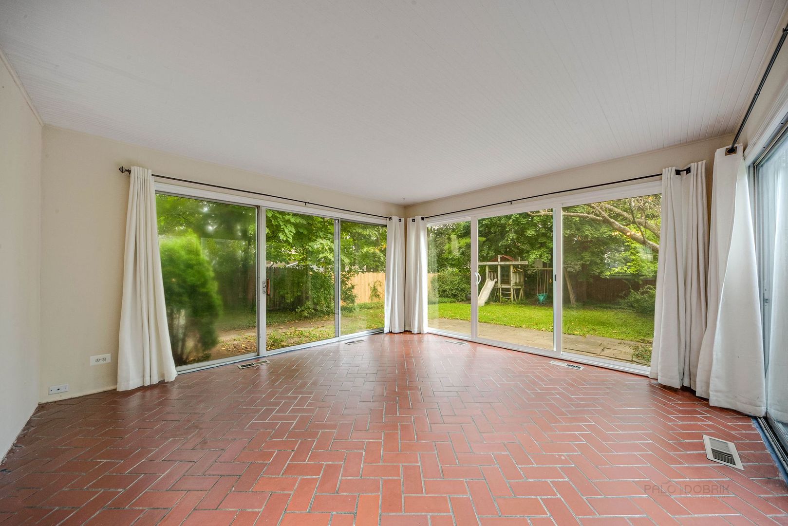 175 Wildwood Road Lake Forest, IL 60045 - Photo 8 of 28 a view of an empty room with wooden floor and a large window