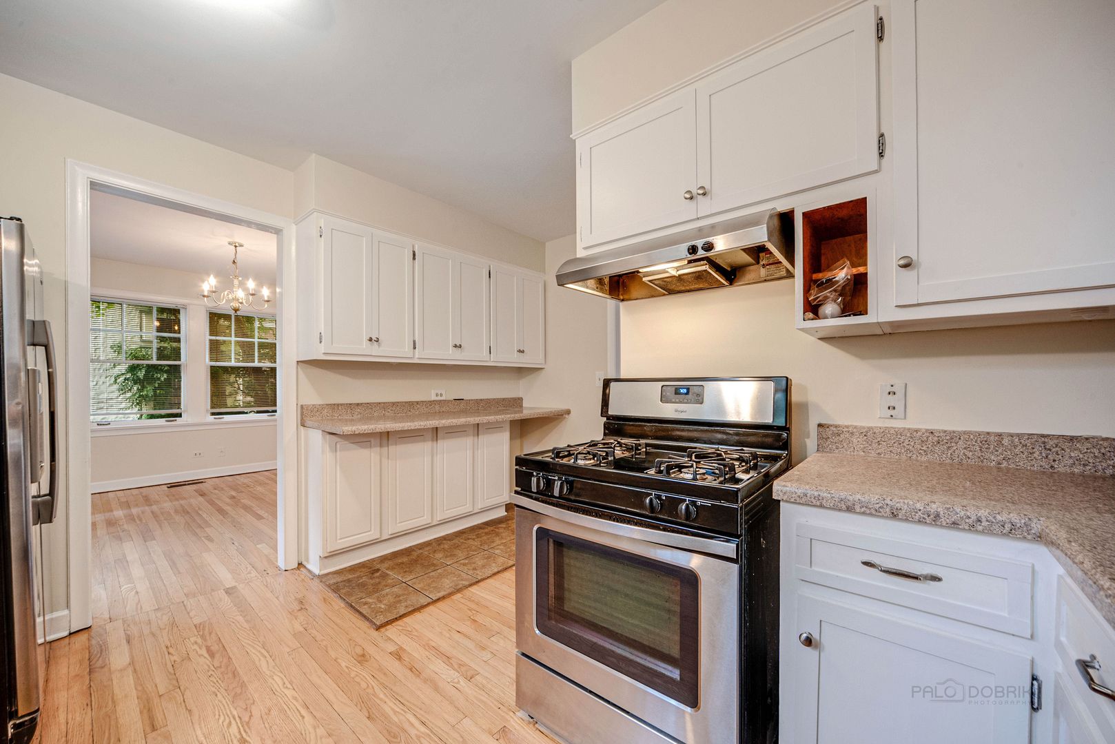 175 Wildwood Road Lake Forest, IL 60045 - Photo 10 of 28 a kitchen with stainless steel appliances white cabinets and a stove top oven