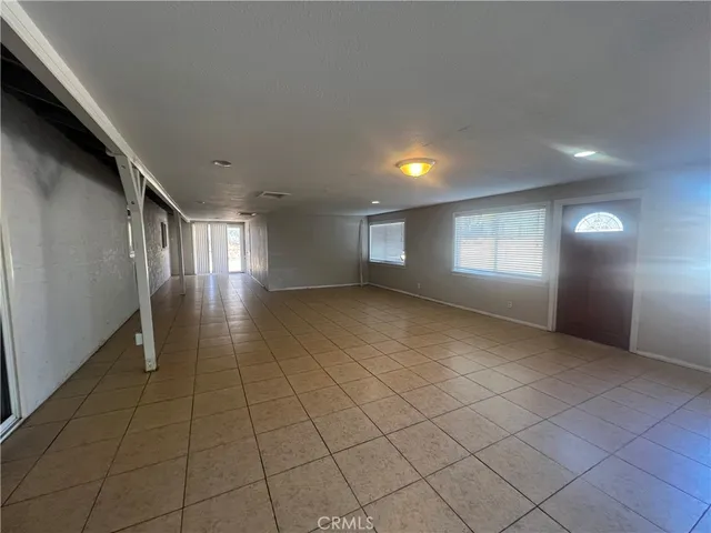a view of an empty room and window