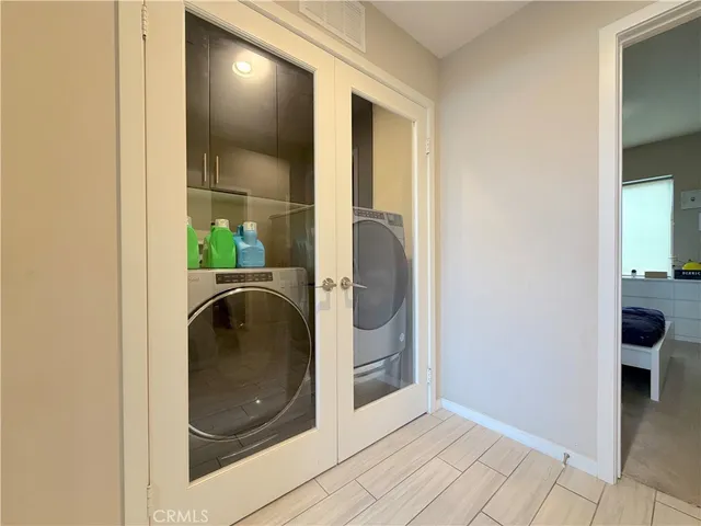 a room with lots of different colored cloths