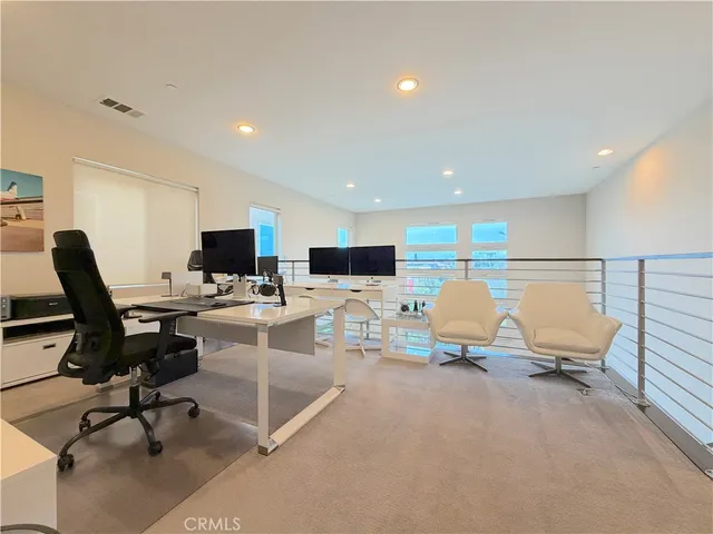 a living room with furniture pool and a flat screen tv