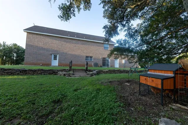 a view of a big yard with palm trees