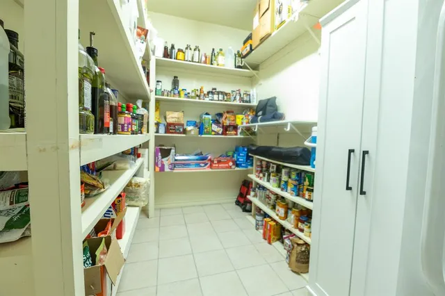 a view of entryway with wooden floor and stairs