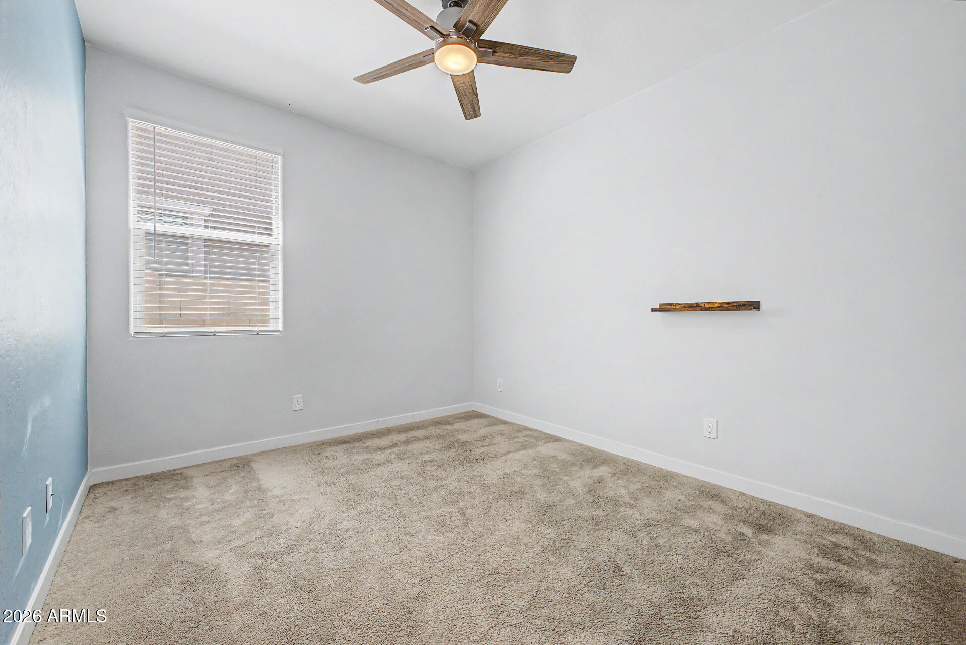 23080 East Stacey Road Queen Creek, AZ 85142 - Photo 33 of 42 an empty room with a window and a fan