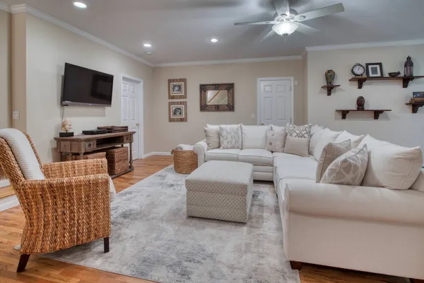 a living room with furniture and a flat screen tv