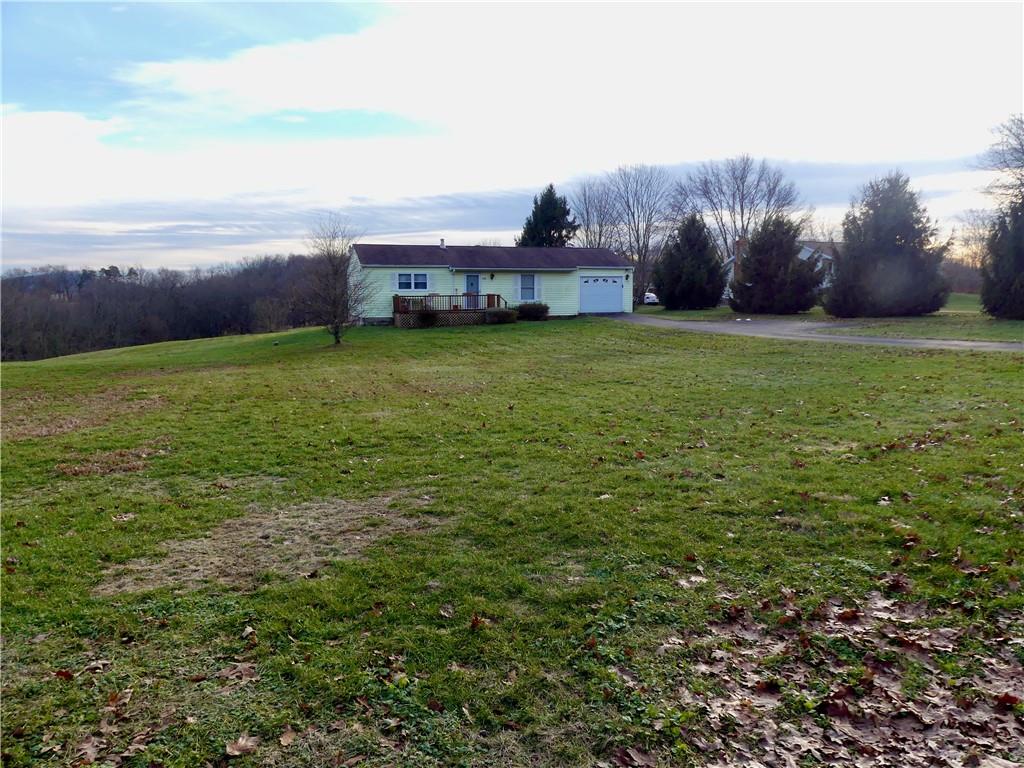 278 Kaufman Road Evans City, PA 16033 - Photo 2 of 22 Another view showcasing the flat, parklike yard.