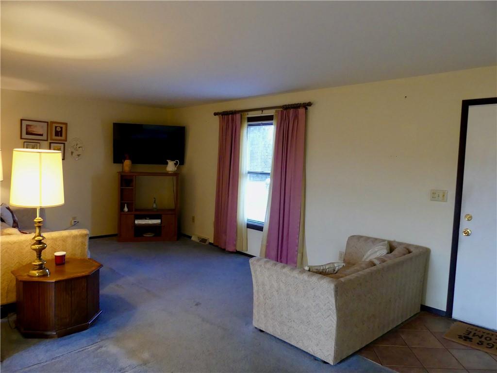 278 Kaufman Road Evans City, PA 16033 - Photo 3 of 22 The front door opens right into the living room, with space to remove your shoes.