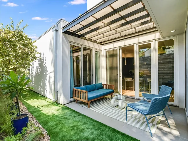 a backyard of a house with seating space