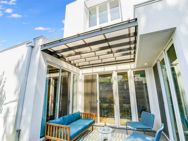 a front view of a house with a glass door