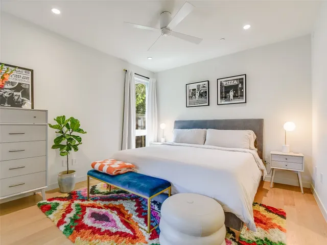 a bedroom with a bed and a dresser