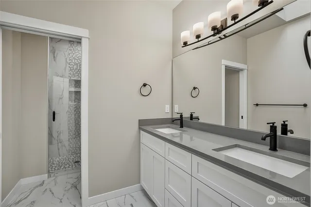 a white toilet sitting next to a bathroom sink