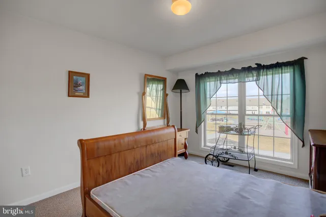 a bed room with a bed and a window