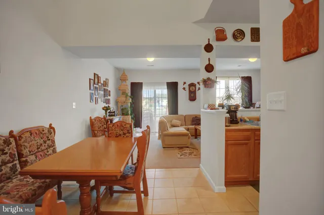 a kitchen with stainless steel appliances a refrigerator sink and cabinets