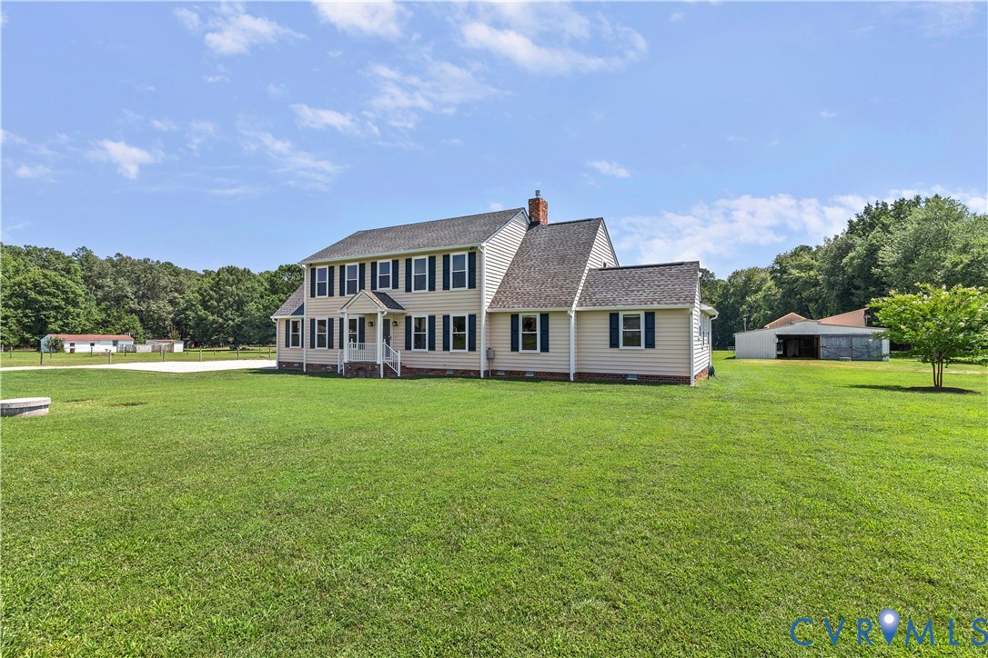 a view of a house with a big yard