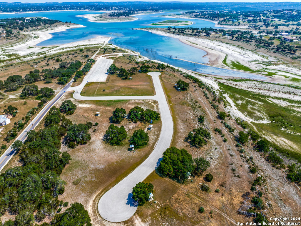 23375 North Cranes Mill Road Canyon Lake, TX 78070 - Photo 11 of 13 an aerial view of a swimming pool with outdoor space