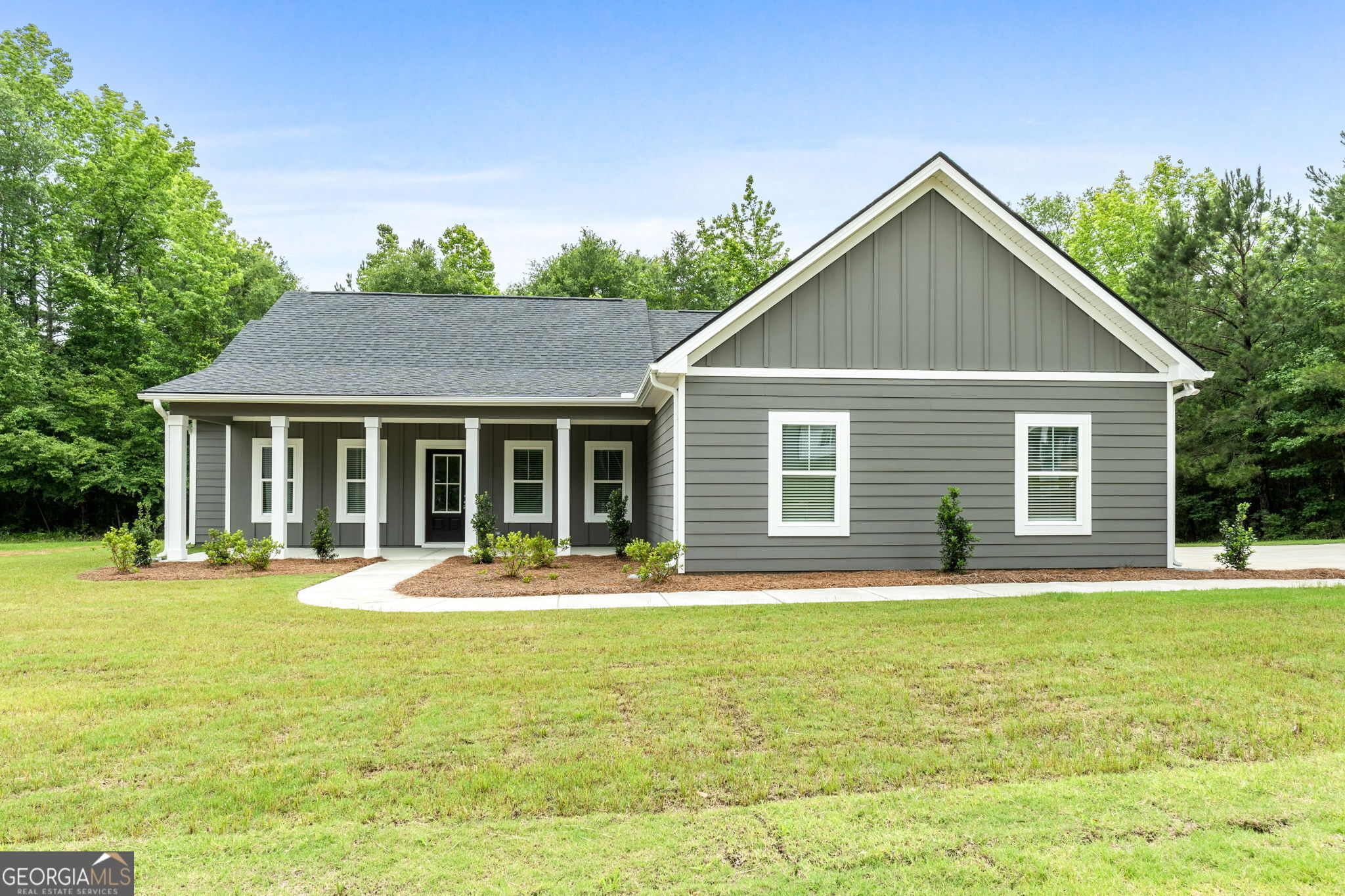 910 Bevis Road Franklin, GA 30217 - Photo 1 of 1 a front view of a house with a yard table and chairs