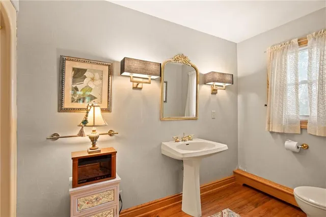 a living room with furniture a flat screen tv and a large window