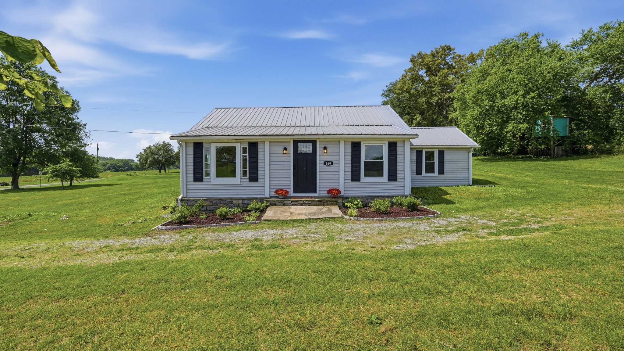 469 Fred Cooper Road McMinnville, TN 37110 - Photo 3 of 46 a view of a house with a backyard