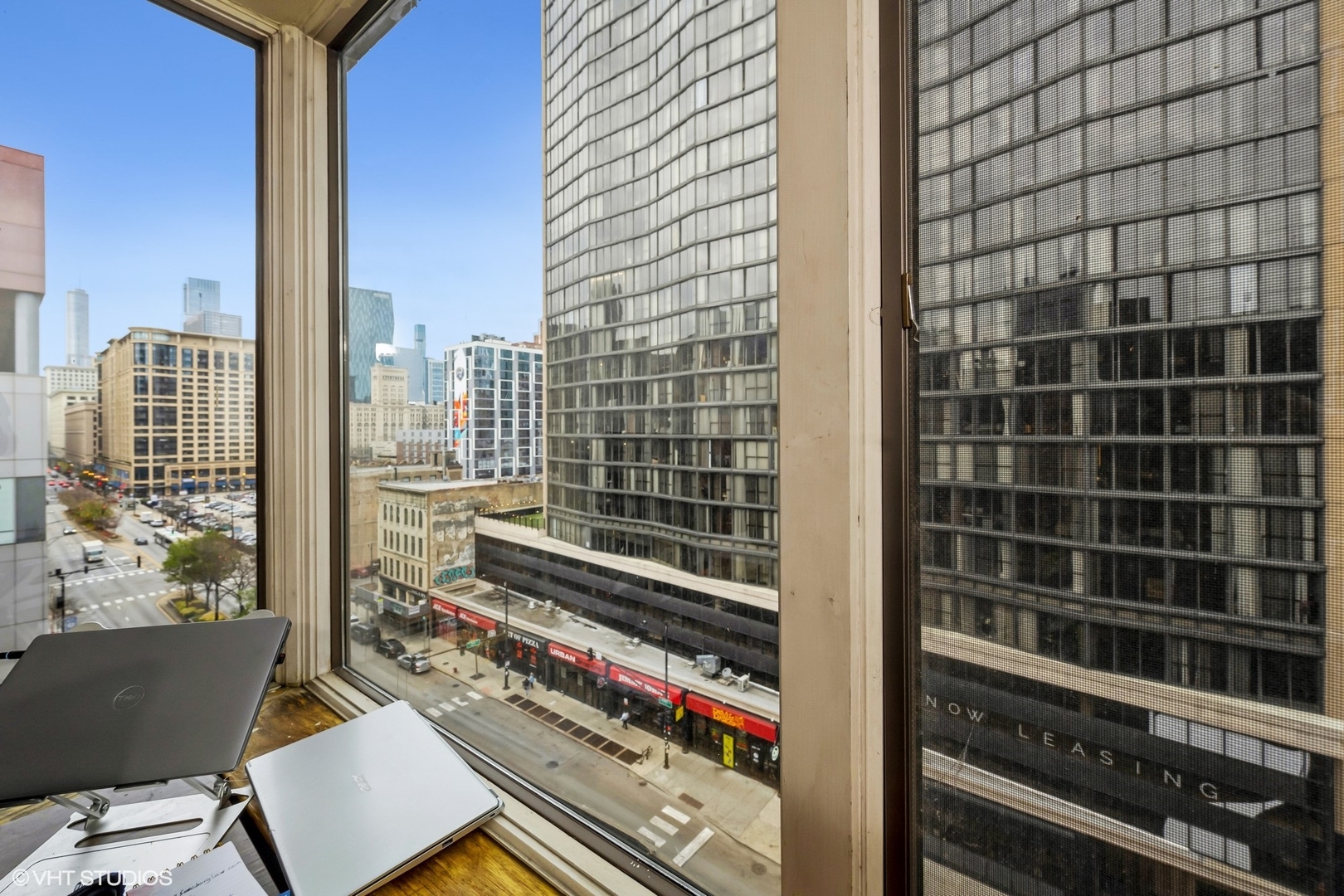 801 South Plymouth Court, Unit 809 Chicago, IL 60605 - Photo 9 of 10 a view of a balcony with wooden floor