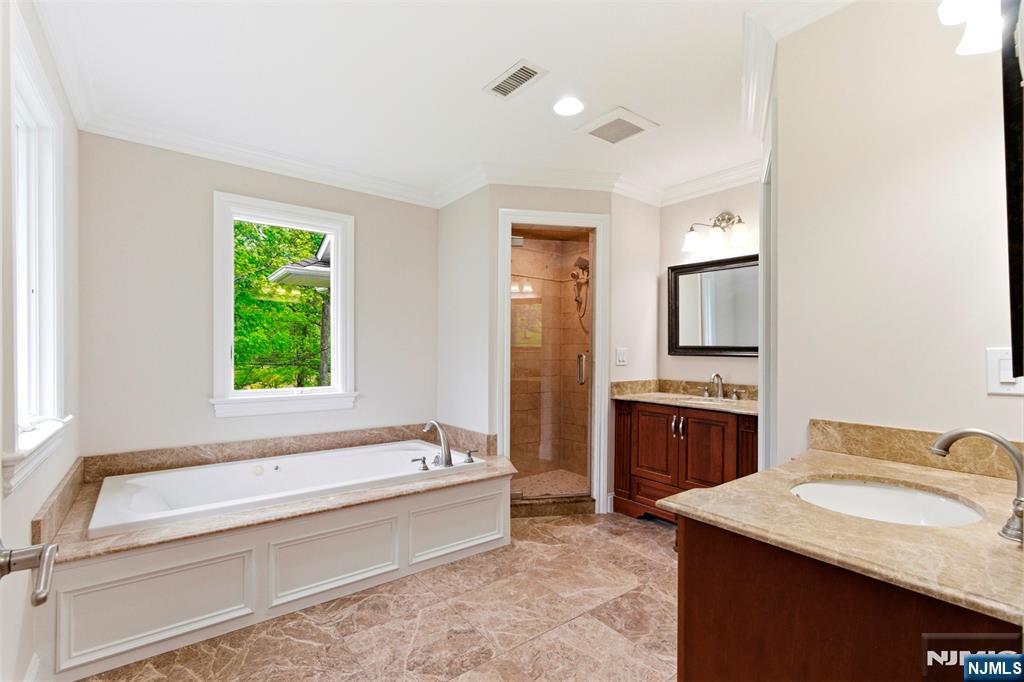 767 Orangeburgh Road River Vale, NJ 07675 - Photo 37 of 49 a spacious bathroom with a tub sink and mirror