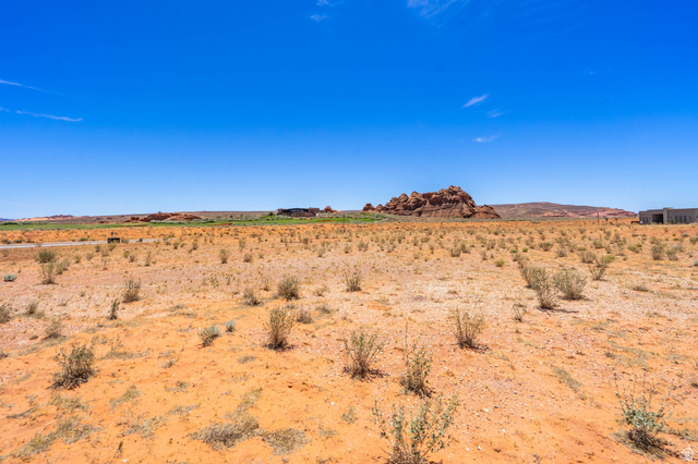 3306 South Endless Trail, Unit 33 Hurricane, UT 84737 - Photo 16 of 27 Expansive desert landscape featuring reddish-brown soil and sparse vegetation