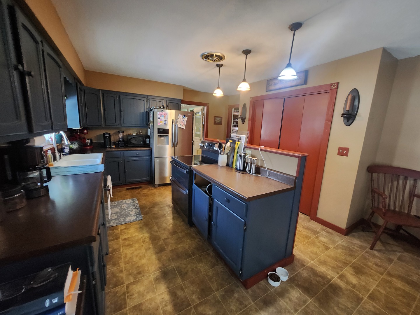 3649 Hamilton Park Road Pinckneyville, IL 62274 - Photo 24 of 24 a kitchen with stainless steel appliances granite countertop a stove a sink a refrigerator and a wooden cabinets