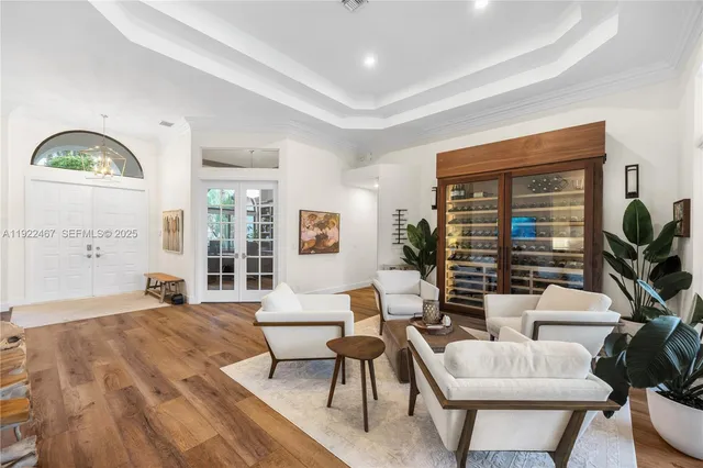 a kitchen with kitchen island granite countertop a sink appliances and cabinets