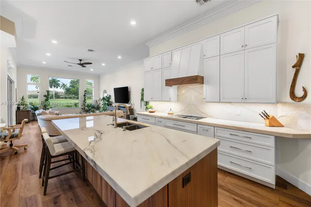a bedroom with a bed and a lamp on the dresser