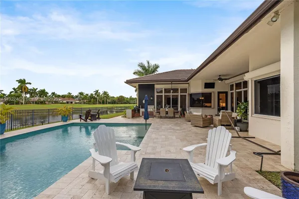 a view of a patio with couches chairs and a table