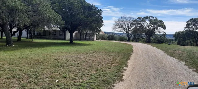 a view of a park with tree s