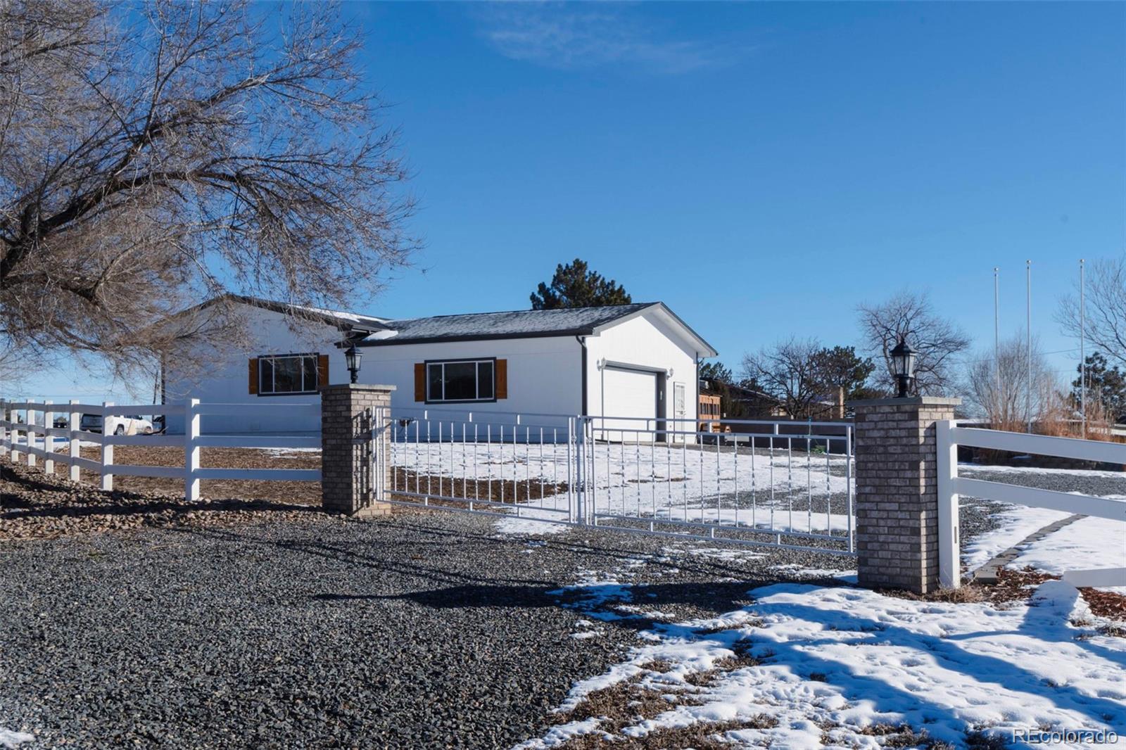 9910 Ammons Circle Westminster, CO 80021 - Photo 28 of 39 a front view of a house with garden