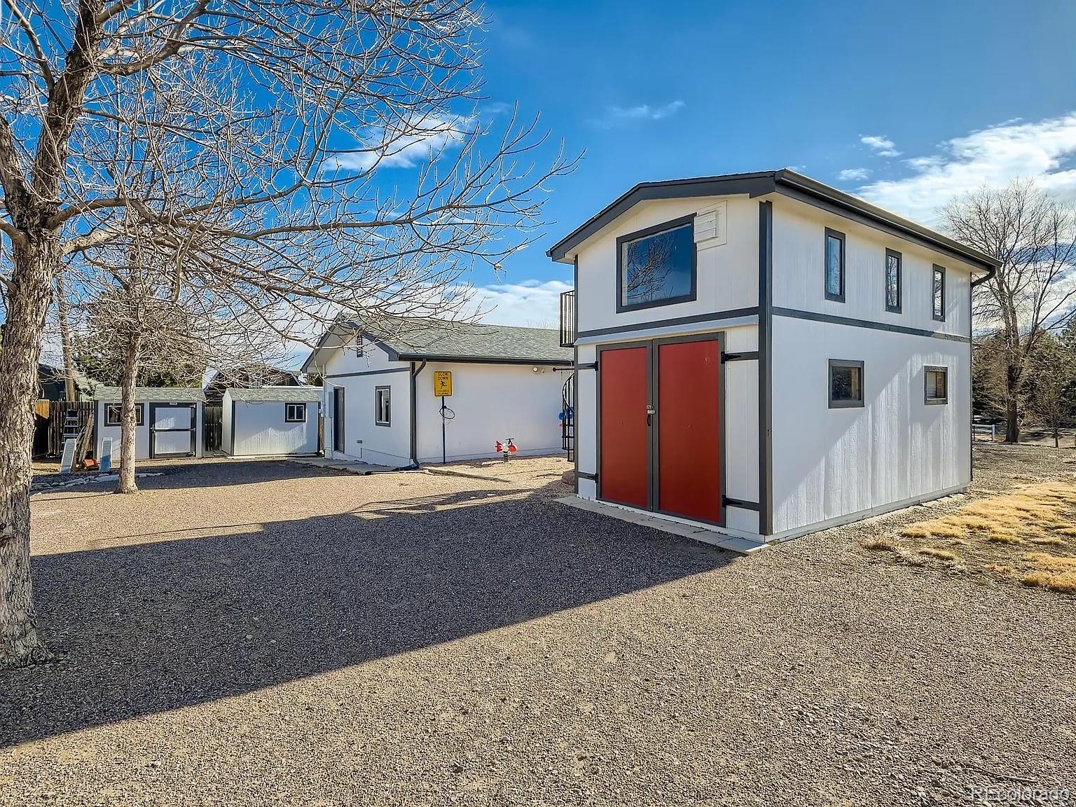 9910 Ammons Circle Westminster, CO 80021 - Photo 36 of 39 a front view of a house with a yard
