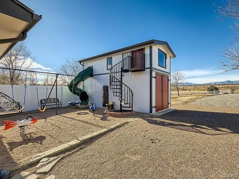 9910 Ammons Circle Westminster, CO 80021 - Photo 37 of 39 a view of a street with a building in the background