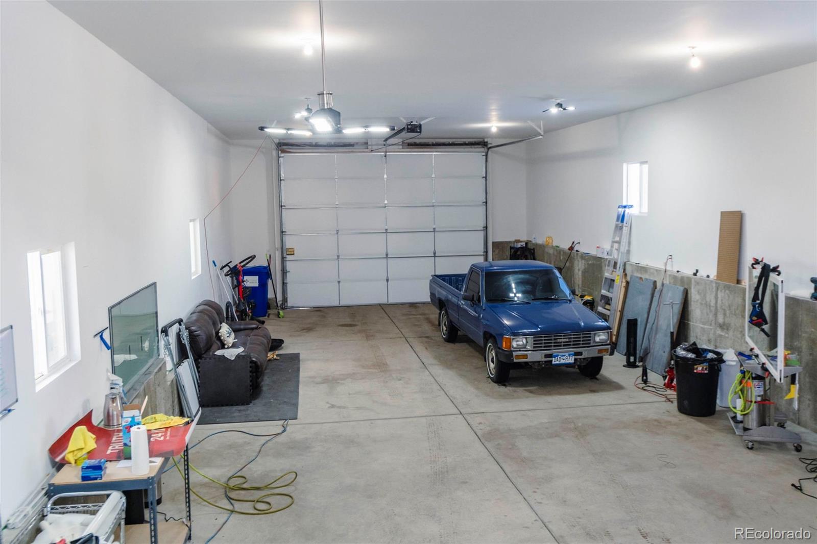 9910 Ammons Circle Westminster, CO 80021 - Photo 38 of 39 a car is parked in a garage