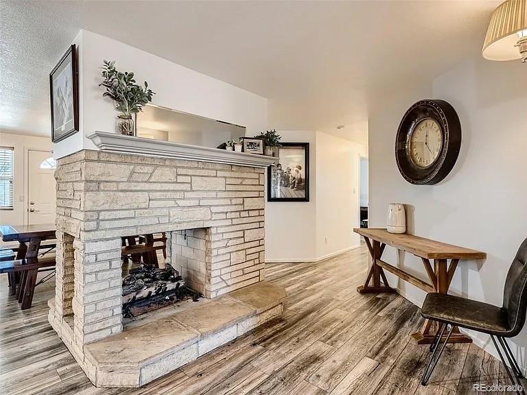 9910 Ammons Circle Westminster, CO 80021 - Photo 6 of 39 a view of a livingroom with furniture and wooden floor