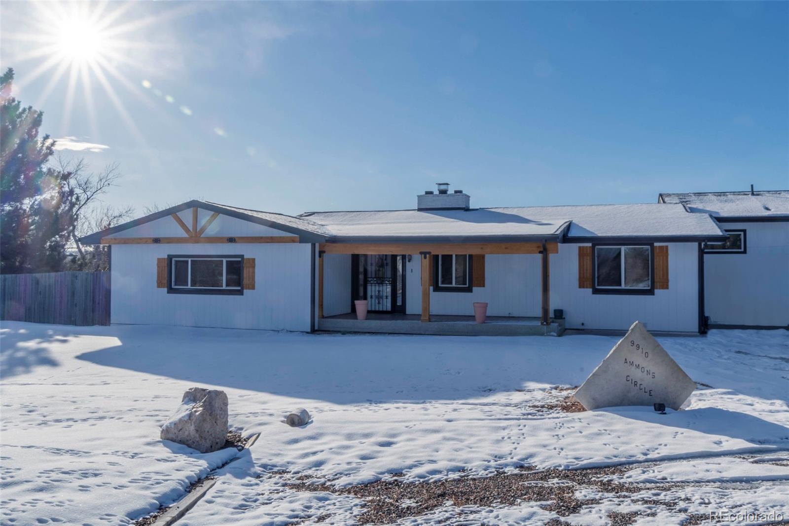 9910 Ammons Circle Westminster, CO 80021 - Photo 8 of 39 a view of a house with a snow in the background