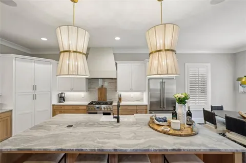a kitchen with cabinets a sink stove and refrigerator