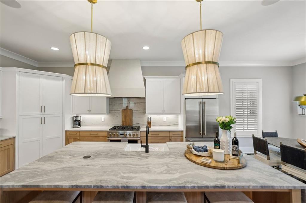 2591 Apple Valley Road Brookhaven, GA 30319 - Photo 11 of 31 a kitchen with kitchen island stainless steel appliances a center island and a chandelier
