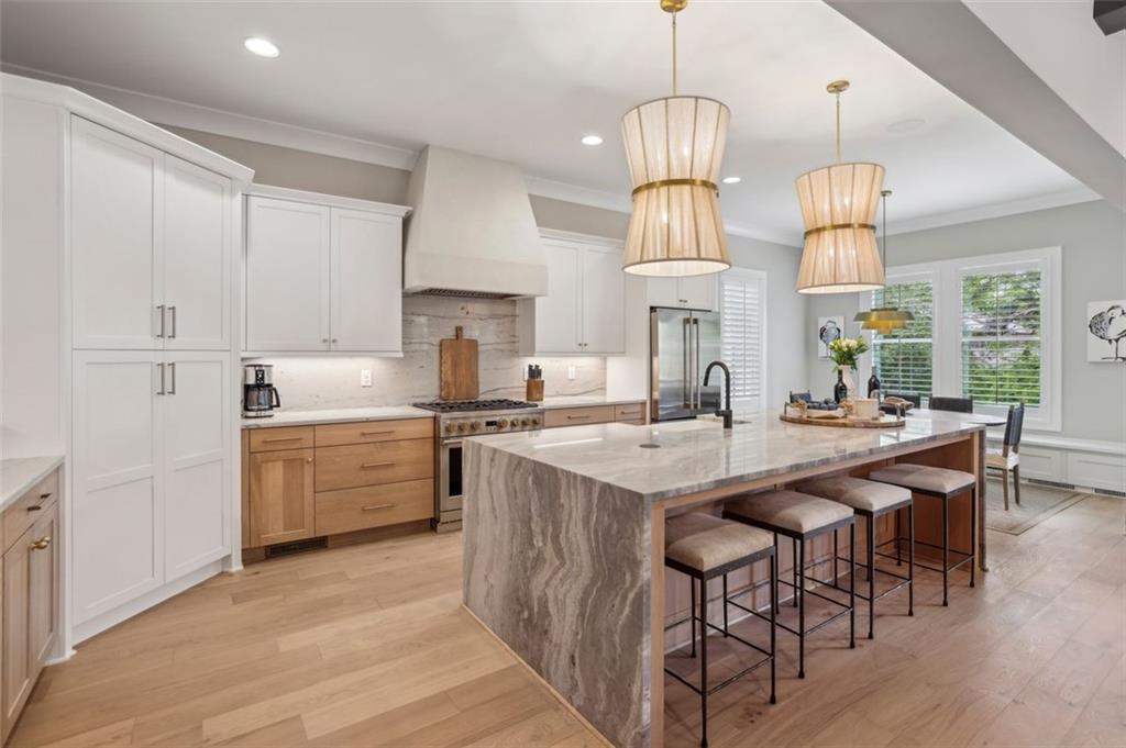 2591 Apple Valley Road Brookhaven, GA 30319 - Photo 12 of 31 a kitchen with cabinets a sink stove and refrigerator