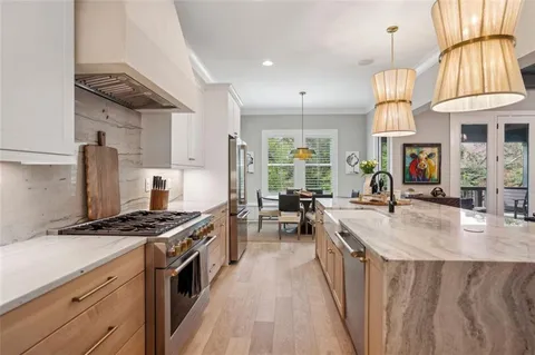 a view of a dining room with furniture and window