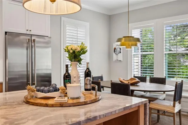 a kitchen with a sink dishwasher a stove and a refrigerator with wooden floor